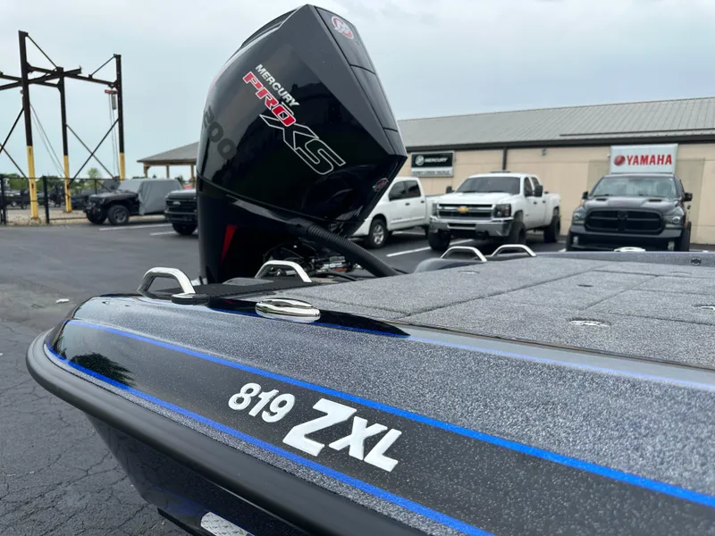 Slide: The Image of 2025 Phoenix 819 ZXL boat with Mercury Pro XS engine in parking lot. - 14