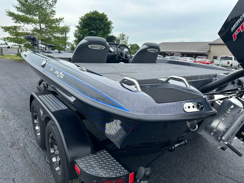 Slide: The Image of 2025 Phoenix 819 ZXL boat on trailer, sleek design, dual seats, outdoor setting. - 8