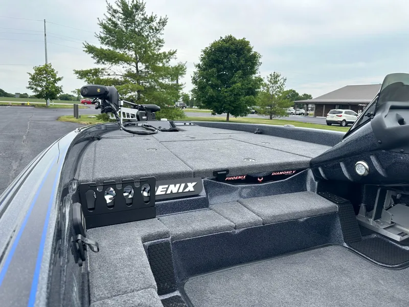 Slide: The Image of 2025 Phoenix 819 ZXL boat deck with advanced fishing equipment and spacious layout. - 9