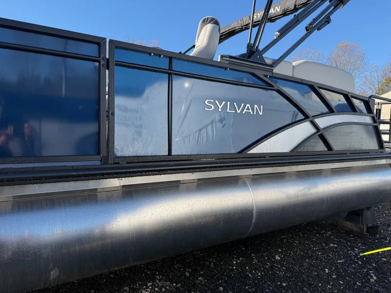Slide: The Image of 2025 Sylvan L-3 LZ pontoon boat with sleek design and modern features. - 0