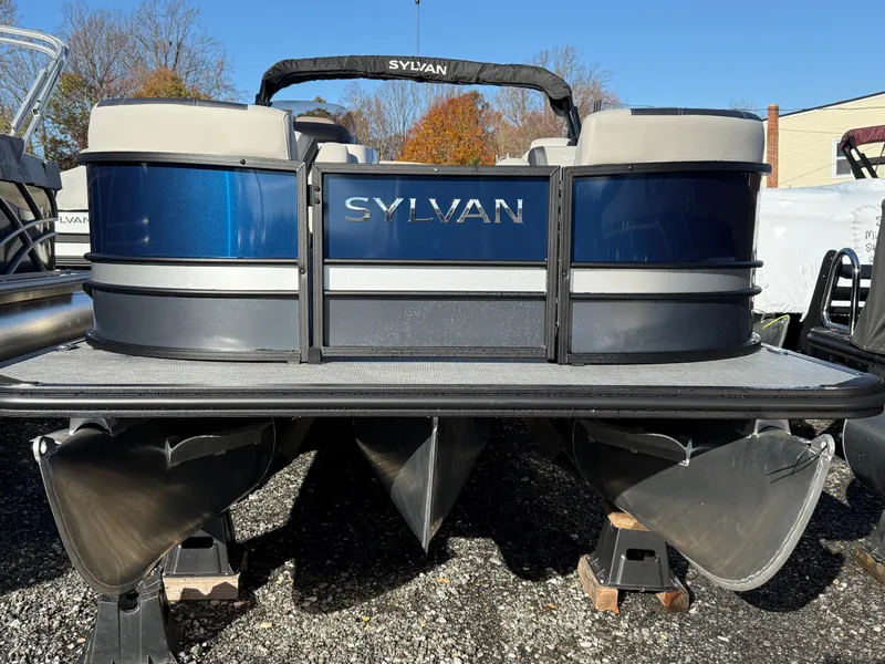 Slide: The Image of 2025 Sylvan L-3 LZ pontoon boat with blue exterior, displayed outdoors. - 1