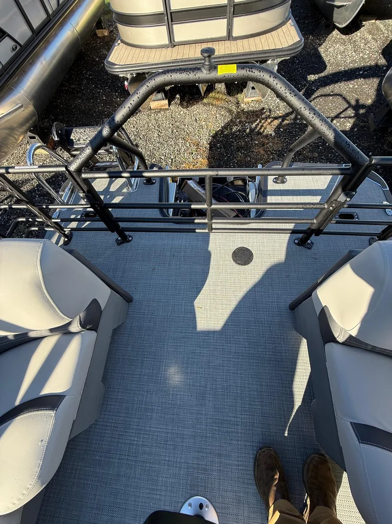 Slide: The Image of Interior view of 2025 Sylvan L-3 LZ pontoon boat with seating and railing. - 10