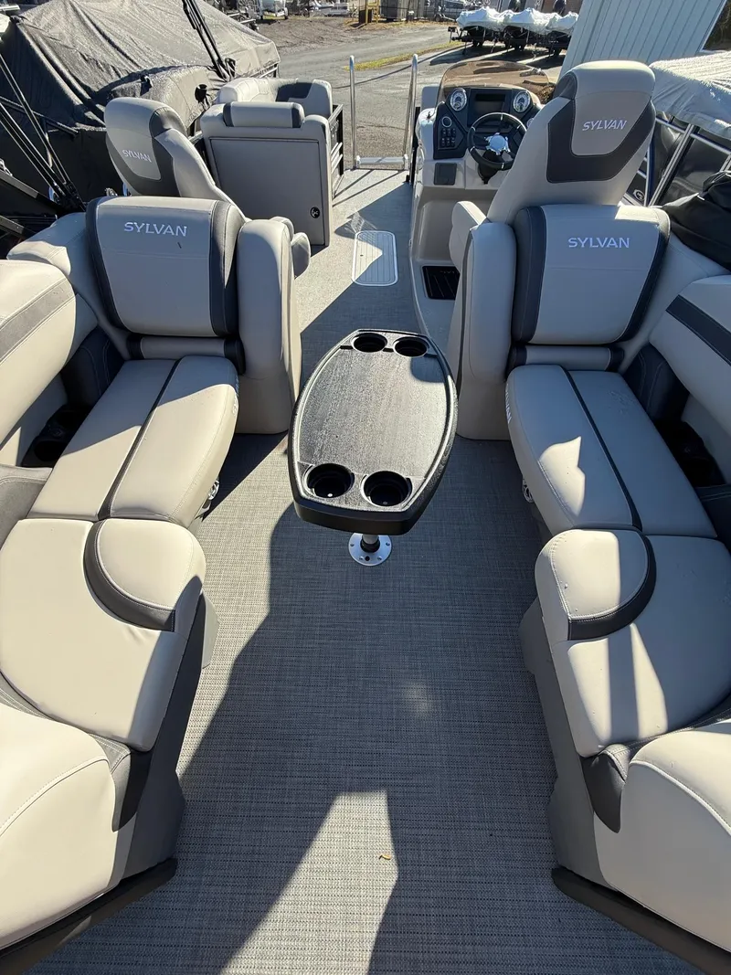 Slide: The Image of 2025 Sylvan L-3 LZ boat interior with plush seating and central table. - 11