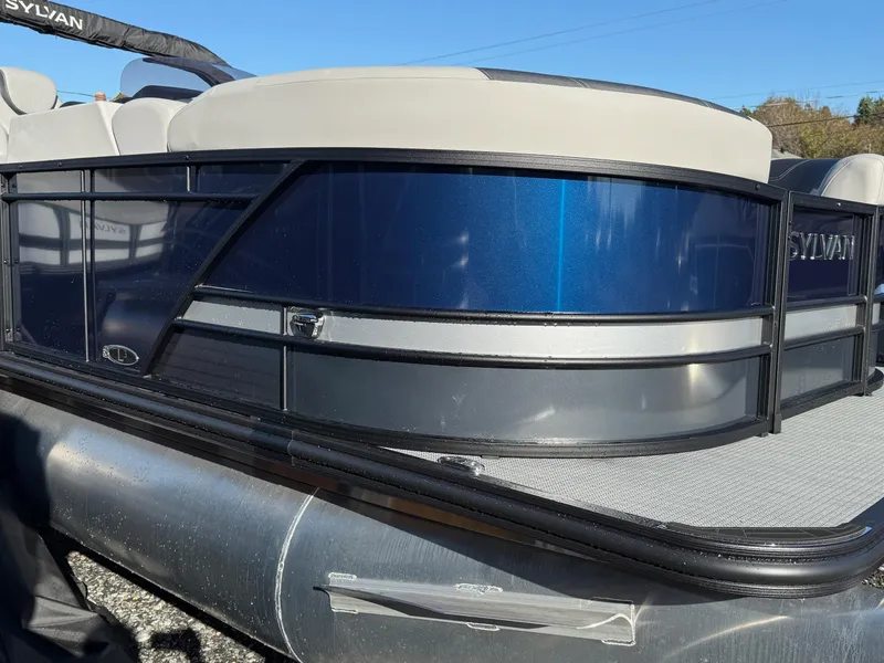 Slide: The Image of 2025 Sylvan L-3 LZ pontoon boat with sleek blue and silver design. - 2