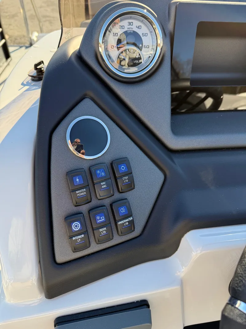 Slide: The Image of Control panel of 2025 Sylvan L-3 LZ boat with speedometer and buttons. - 21