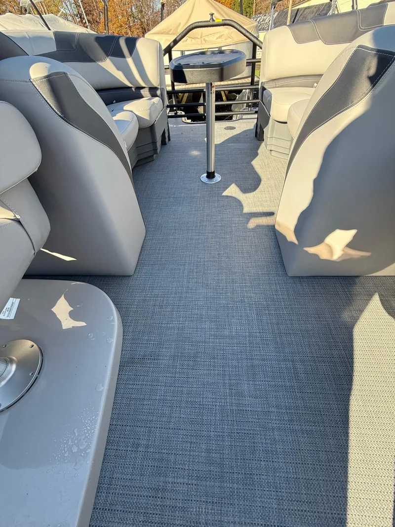 Slide: The Image of 2025 Sylvan L-3 LZ boat interior with gray seating and flooring. - 24