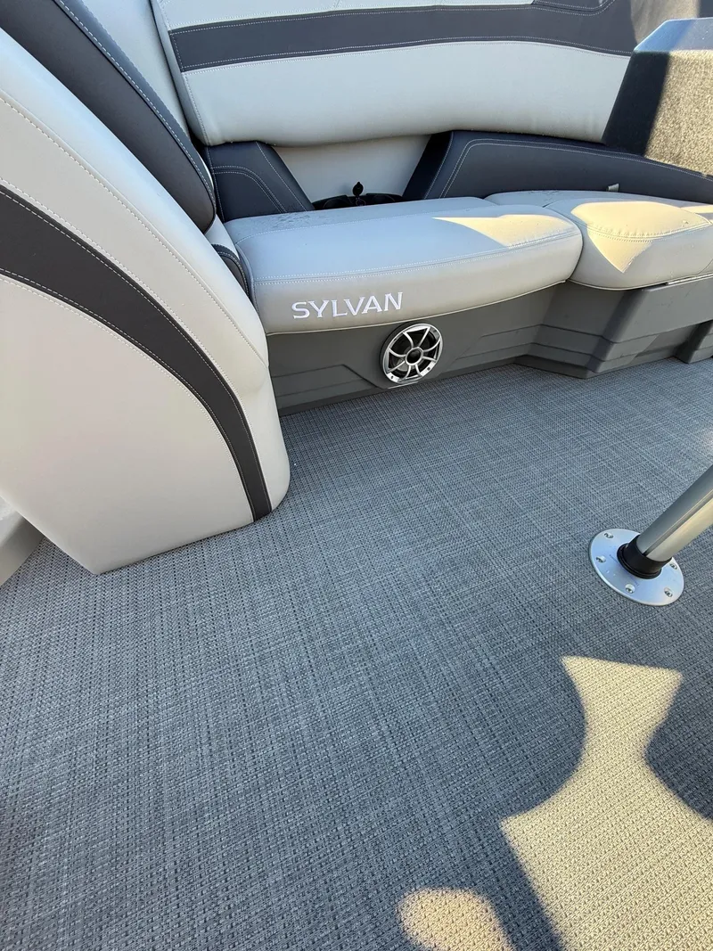 Slide: The Image of 2025 Sylvan L-3 LZ boat interior with gray seating and carpet flooring. - 25