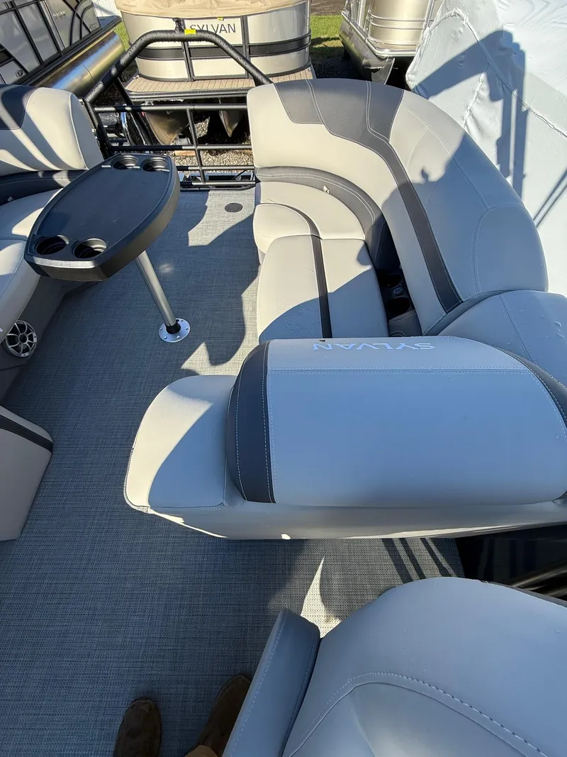 Slide: The Image of 2025 Sylvan L-3 LZ pontoon boat interior with gray seating and table. - 8