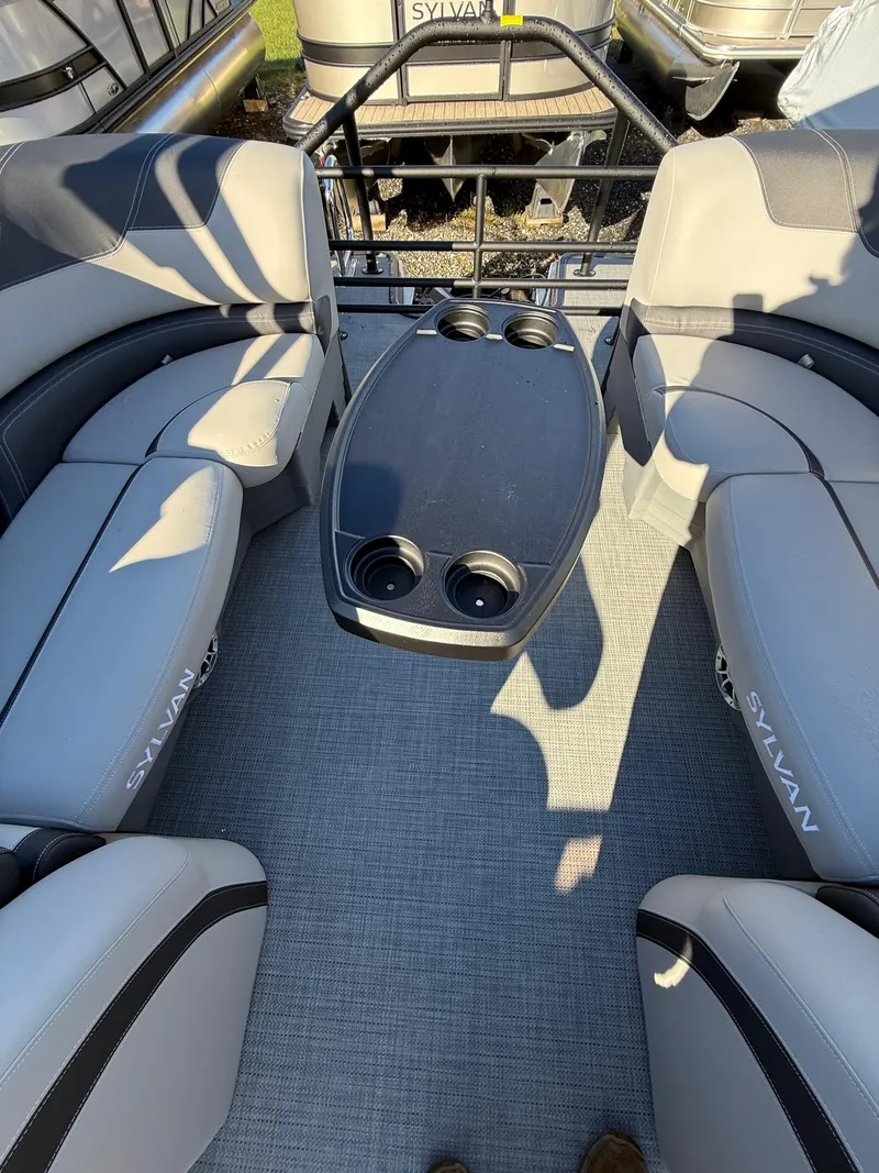 Slide: The Image of 2025 Sylvan L-3 LZ boat interior with gray seating and cup holders. - 9
