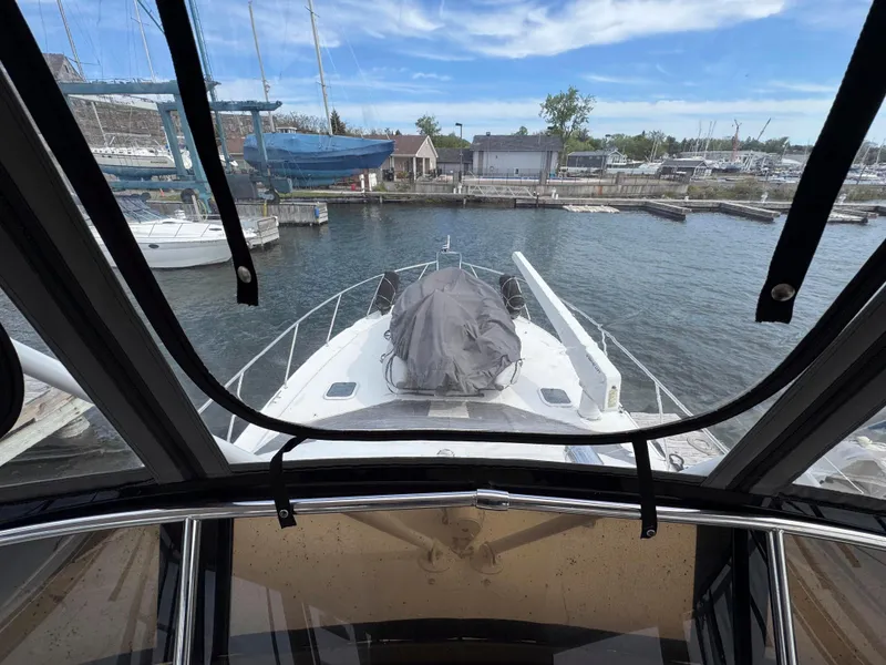 Slide: The Image of 1997 Silverton 41 Convertible yacht docked at marina, view from cabin. - 13