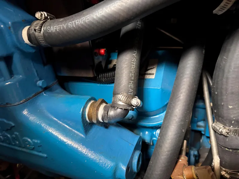 Slide: The Image of Close-up of 1997 Silverton 41 Convertible engine with blue components and hoses. - 31