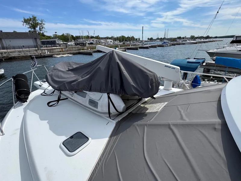 Slide: The Image of 1997 Silverton 41 Convertible yacht docked at marina under clear blue sky. - 8