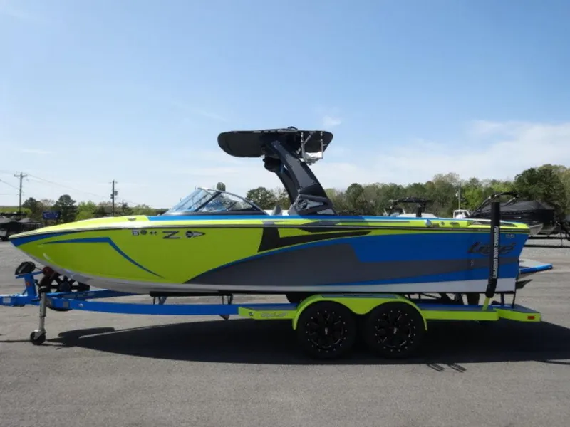 Slide: The Image of 2018 Tigé Z3 boat in vibrant blue and green on a matching trailer. - 1