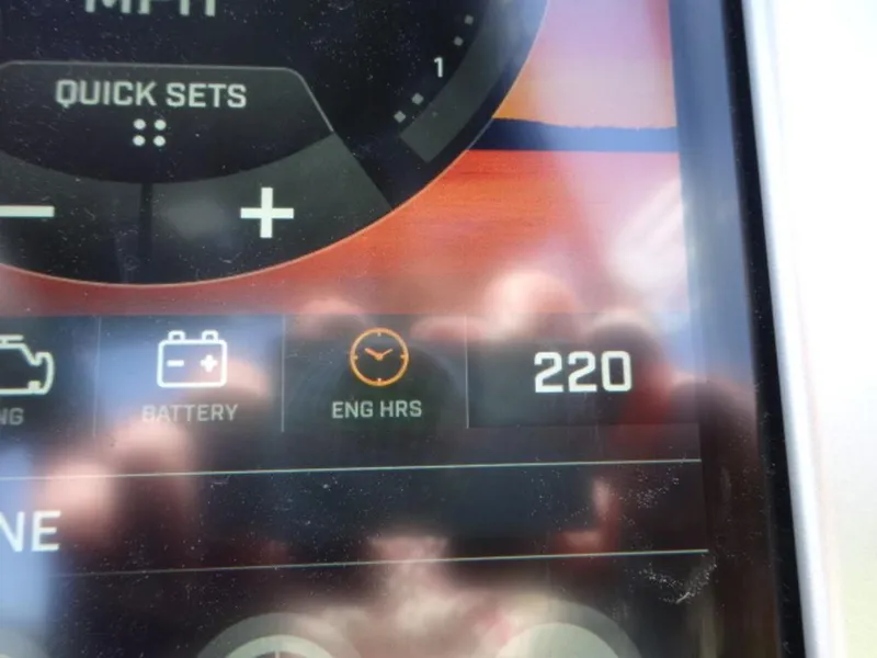 Slide: The Image of Close-up of a 2018 Tigé Z3 dashboard showing 220 engine hours. - 13