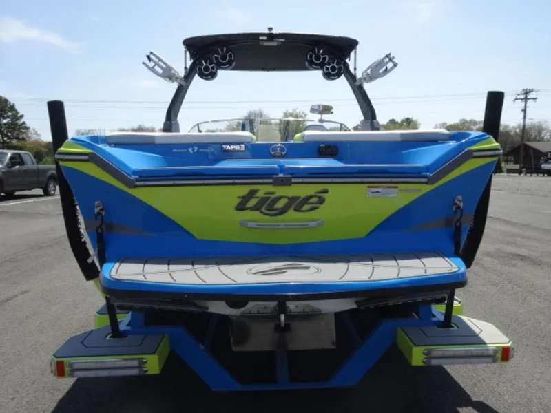 Slide: The Image of 2018 Tigé Z3 boat, blue and green, rear view with wakeboard tower. - 3