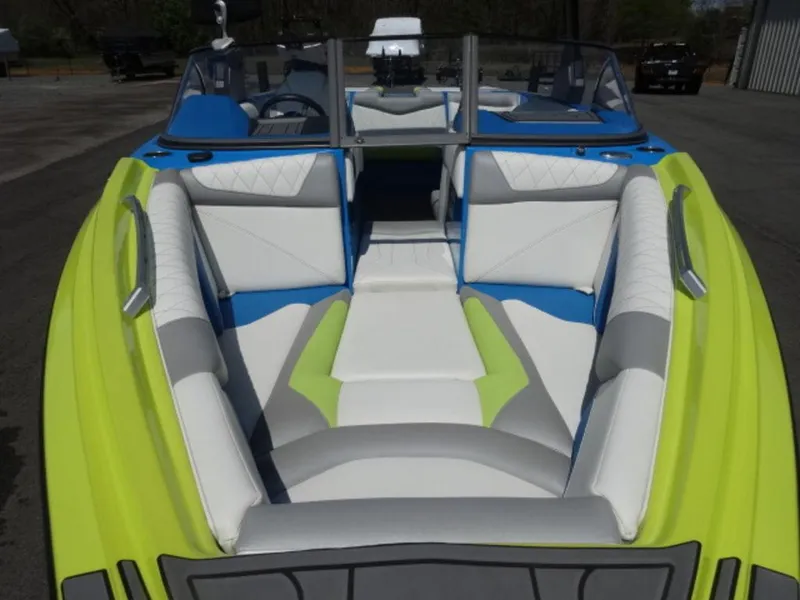 Slide: The Image of 2018 Tigé Z3 boat with vibrant lime green and blue interior seating. - 4