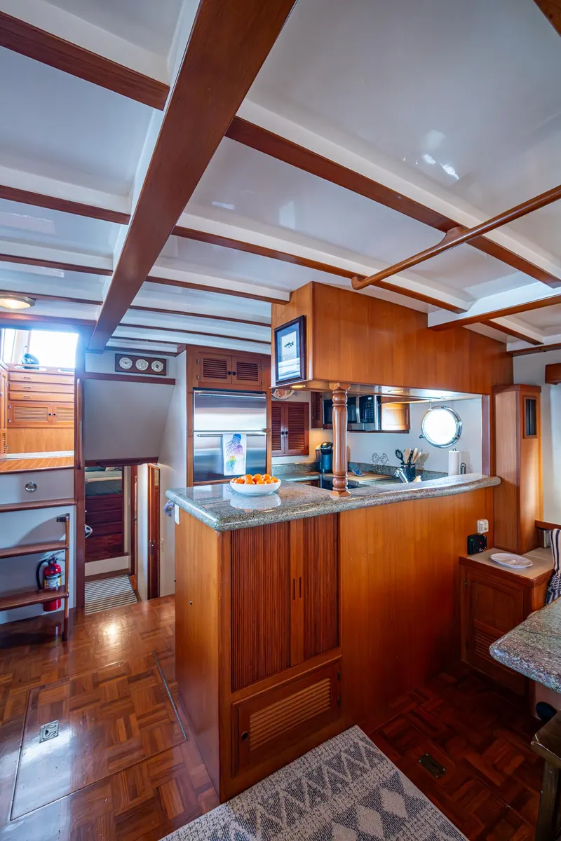 Slide: The Image of Interior of 2000 Kadey-Krogen 48 North Sea yacht with wooden cabinetry and modern amenities. - 12