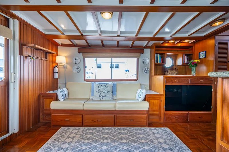 Slide: The Image of Luxurious Kadey-Krogen 48 North Sea yacht interior with elegant wood paneling and cozy seating, 2000 model. - 18