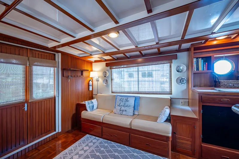Slide: The Image of Cozy interior of 2000 Kadey-Krogen 48 North Sea yacht with wooden accents and comfortable seating. - 19