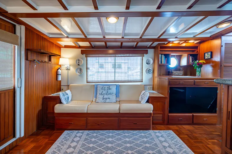 Slide: The Image of Luxurious interior of 2000 Kadey-Krogen 48 North Sea yacht with cozy seating and elegant wood finish. - 22