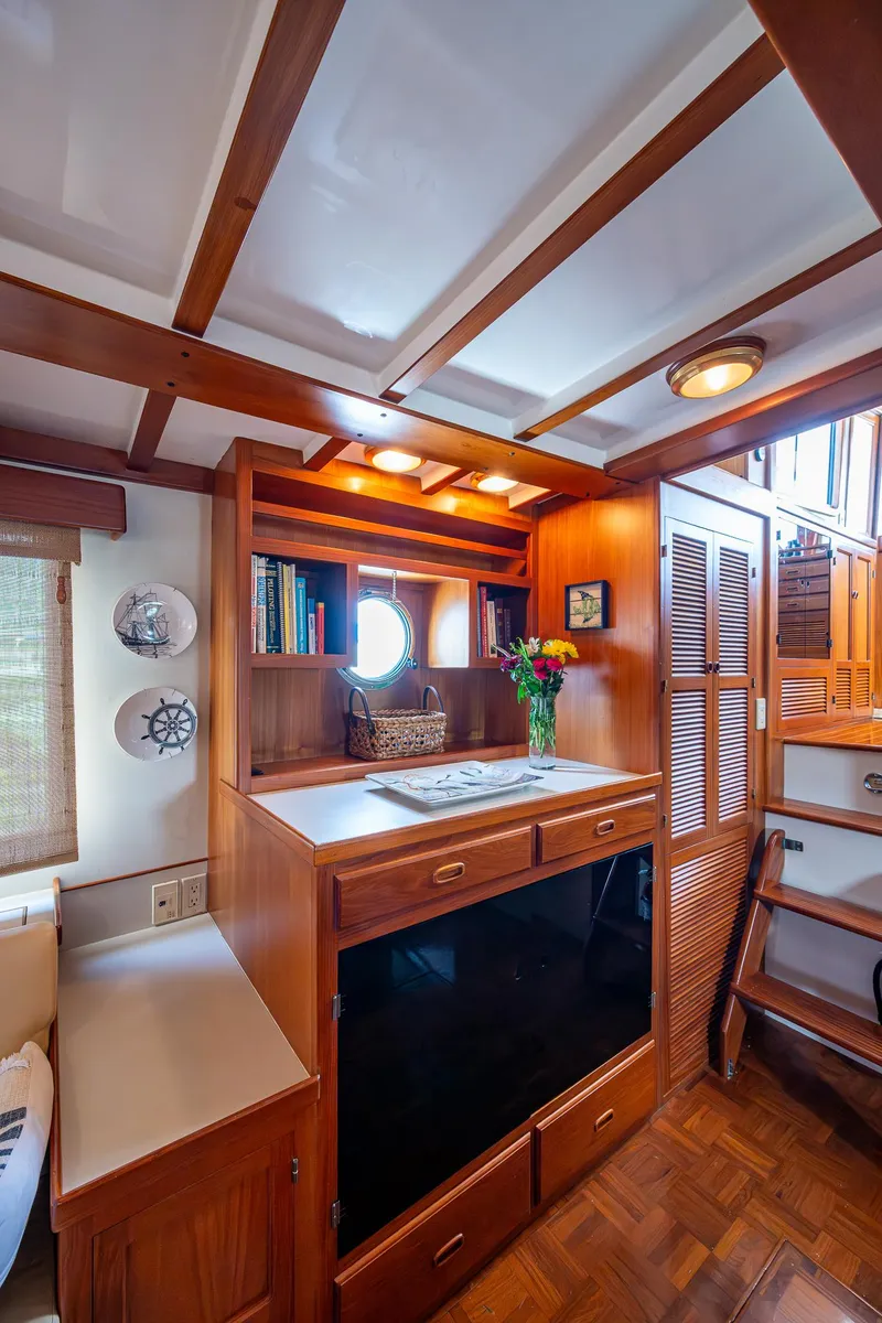 Slide: The Image of Interior of 2000 Kadey-Krogen 48 North Sea yacht with wooden cabinetry and cozy decor. - 23