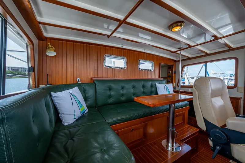 Slide: The Image of Luxurious interior of 2000 Kadey-Krogen 48 North Sea yacht with green leather seating. - 26