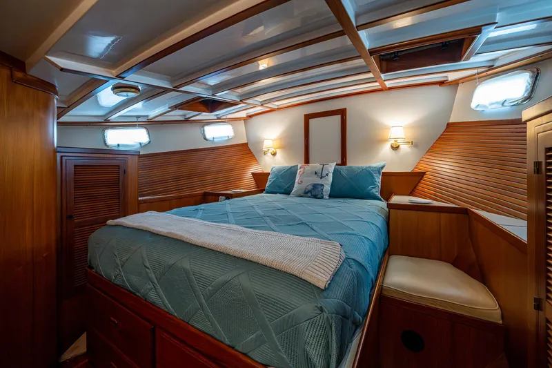 Slide: The Image of Luxurious cabin interior of 2000 Kadey-Krogen 48 North Sea yacht with cozy bedding. - 34