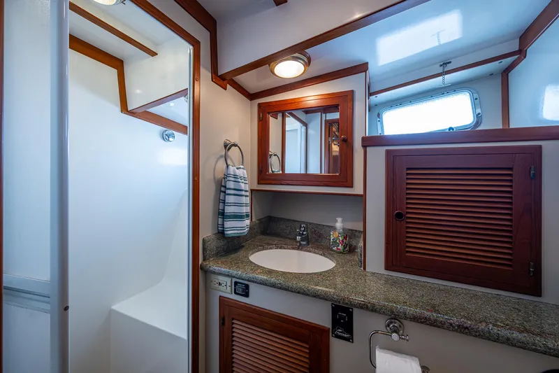 Slide: The Image of Luxurious bathroom in 2000 Kadey-Krogen 48 North Sea yacht with wood accents and modern fixtures. - 38