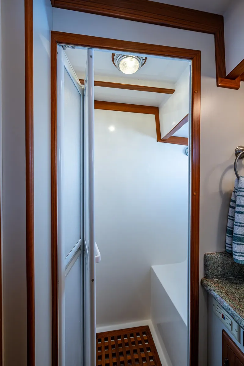 Slide: The Image of Kadey-Krogen 48 North Sea 2000 yacht shower with wooden accents and modern fixtures. - 40