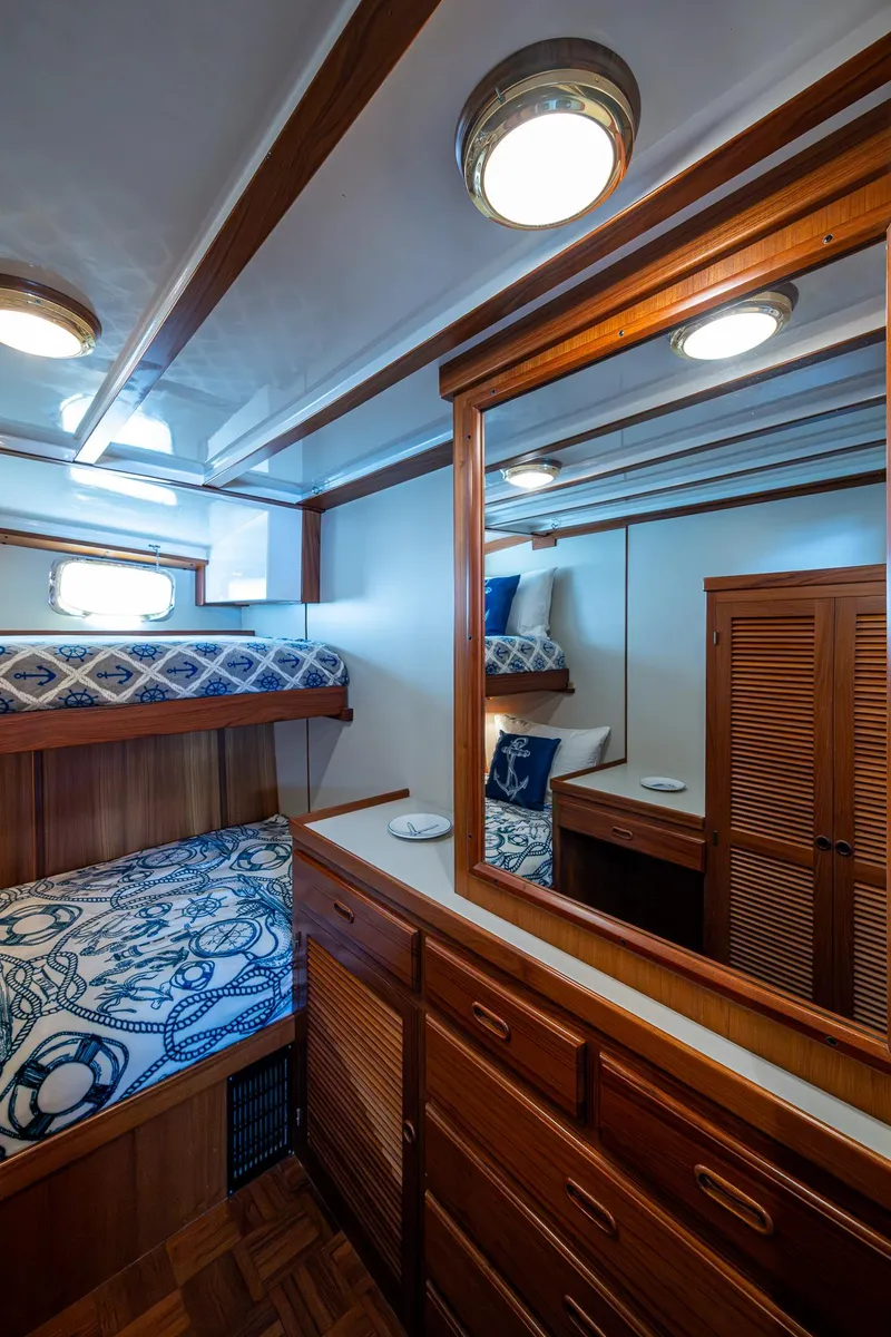 Slide: The Image of Cozy cabin interior of 2000 Kadey-Krogen 48 North Sea with wooden furnishings and nautical decor. - 44