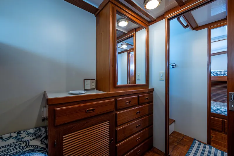 Slide: The Image of Interior of 2000 Kadey-Krogen 48 North Sea yacht with wooden cabinetry and cozy decor. - 46