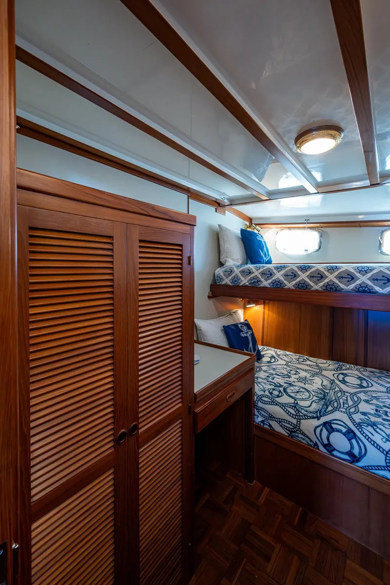 Slide: The Image of Interior of 2000 Kadey-Krogen 48 North Sea yacht with wooden finishes and bunk beds. - 49