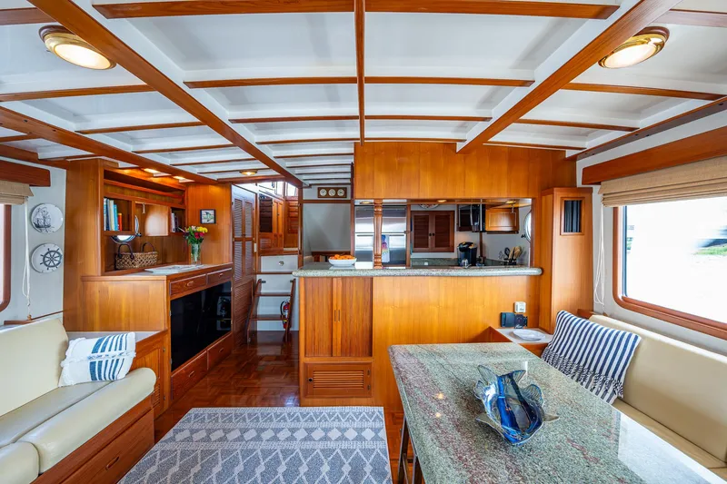 Slide: The Image of Luxurious interior of 2000 Kadey-Krogen 48 North Sea yacht with wood finishes and modern amenities. - 7