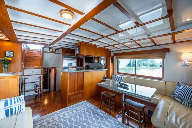 Slide: The Image of Luxurious interior of 2000 Kadey-Krogen 48 North Sea yacht with wood finishes and modern amenities. - 8