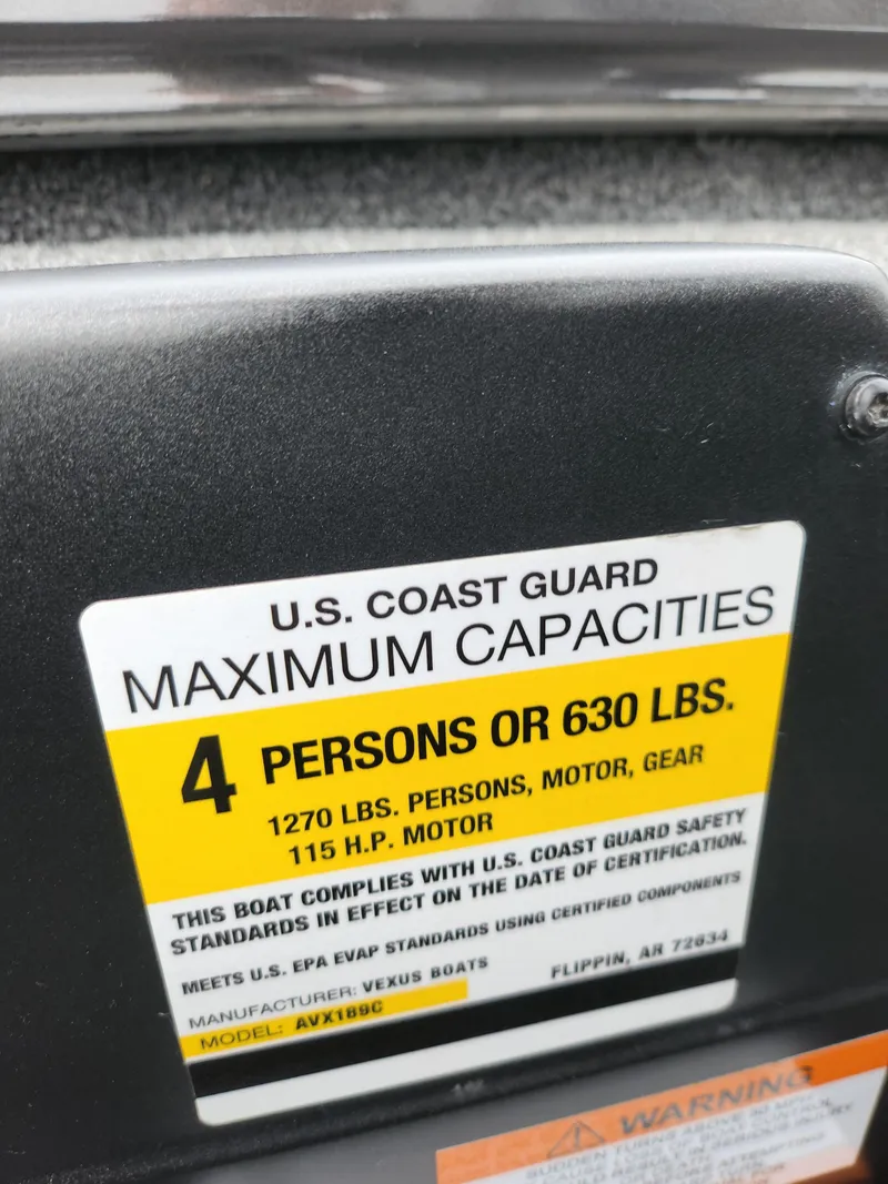 Slide: The Image of U.S. Coast Guard capacity label on 2021 Vexus AVX189 boat, 4 persons or 630 lbs. - 13