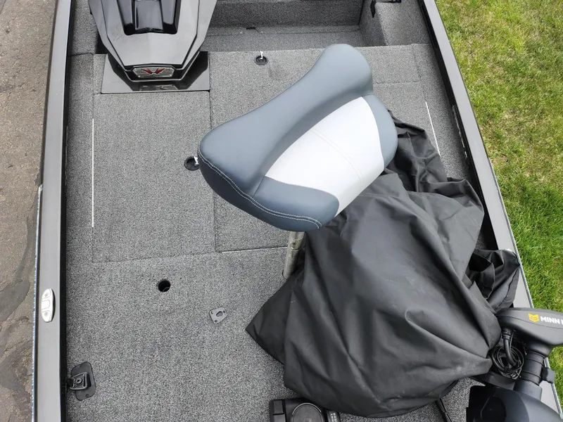 Slide: The Image of 2021 Vexus AVX189 boat interior with gray seating and carpeted flooring. - 19