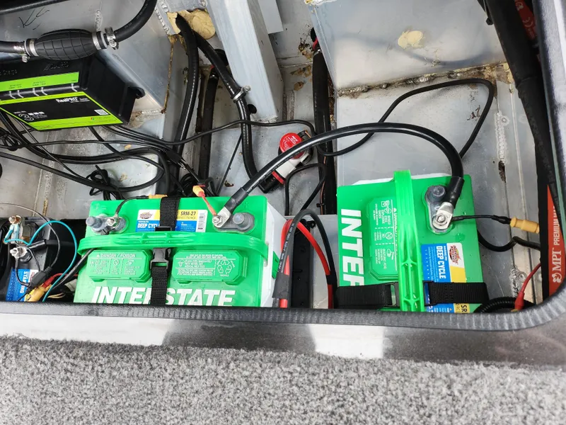 Slide: The Image of 2021 Vexus AVX189 boat battery compartment with Interstate batteries and wiring. - 25
