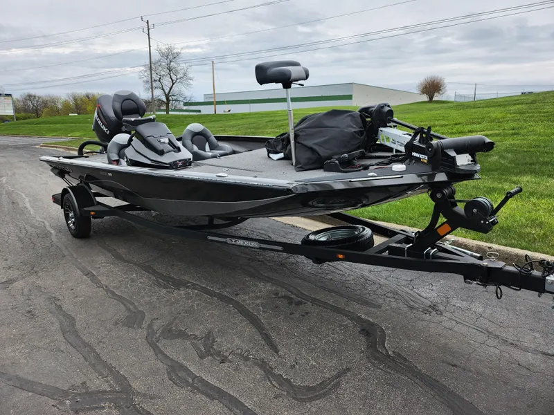 Slide: The Image of 2021 Vexus AVX189 boat on trailer, parked outdoors on a cloudy day. - 5