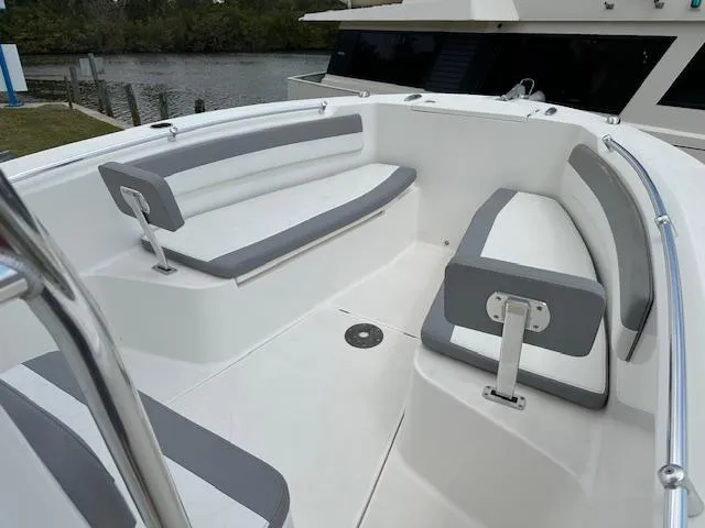 Slide: The Image of 2018 Release 232 RX Center Console boat with spacious seating area and sleek design. - 13
