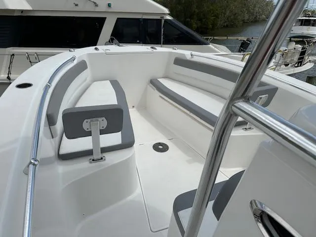 Slide: The Image of 2018 Release 232 RX Center Console boat with spacious seating and sleek design. - 14