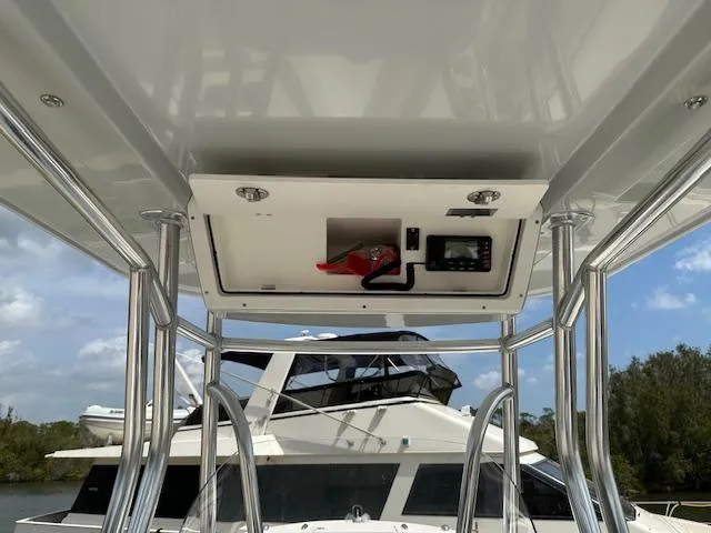 Slide: The Image of 2018 Release 232 RX Center Console boat with overhead storage and control panel. - 18
