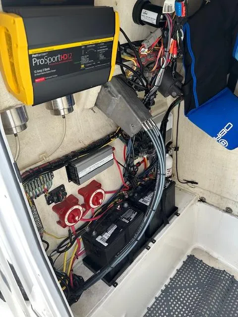 Slide: The Image of 2018 Release 232 RX Center Console boat electrical system with ProSportHD12 charger and batteries. - 20