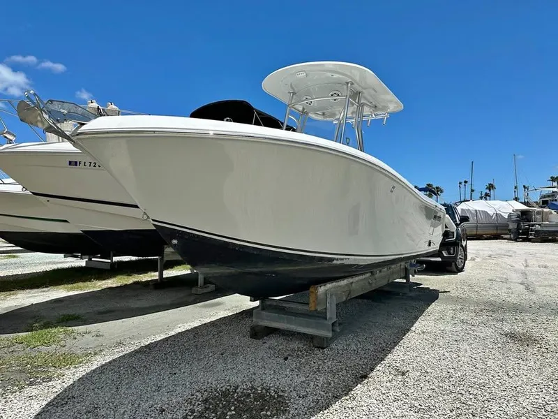 Slide: The Image of 2018 Release 232 RX Center Console boat on display under clear blue sky. - 3