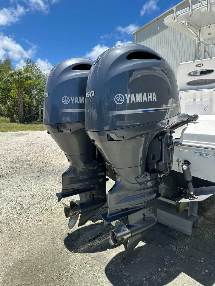 Slide: The Image of Twin Yamaha outboard motors on a 2018 Release 232 RX Center Console boat. - 5