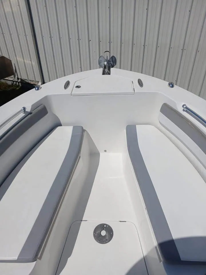 Slide: The Image of 2018 Release 232 RX Center Console boat interior with seating and storage. - 8