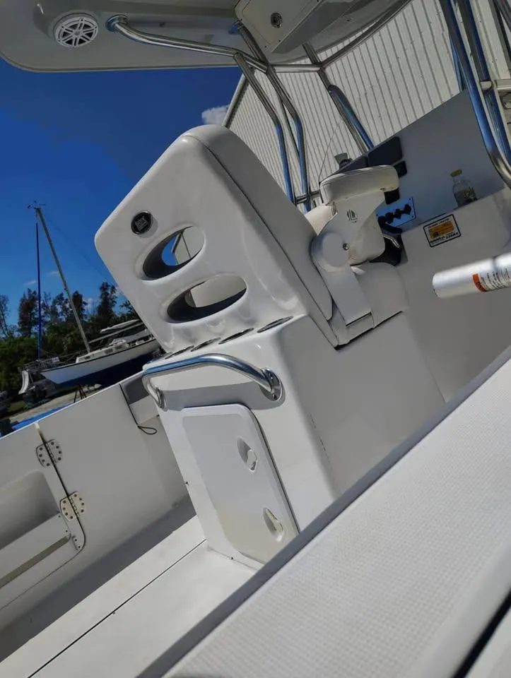 Slide: The Image of 2018 Release 232 RX Center Console boat interior with seating and storage. - 9