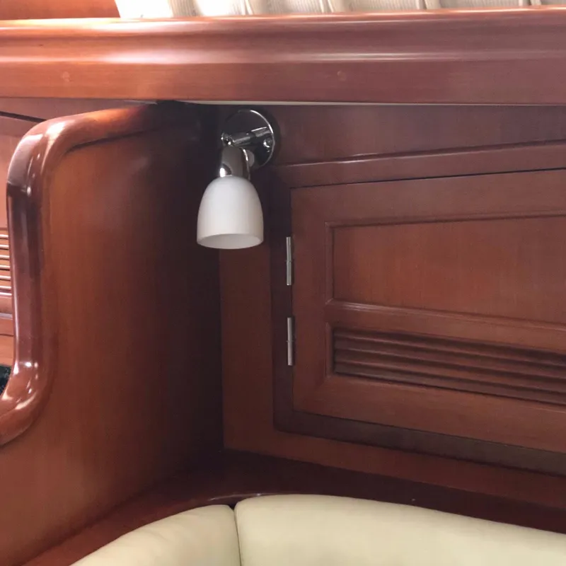 Slide: The Image of Wooden interior of 2000 Outbound 44 yacht with light fixture and cabinet. - 16