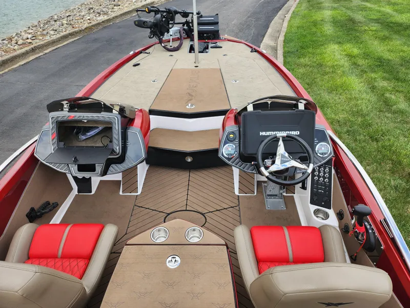Slide: The Image of 2020 Vexus VX20 boat interior with red and beige seating, dual consoles, and advanced navigation systems. - 11