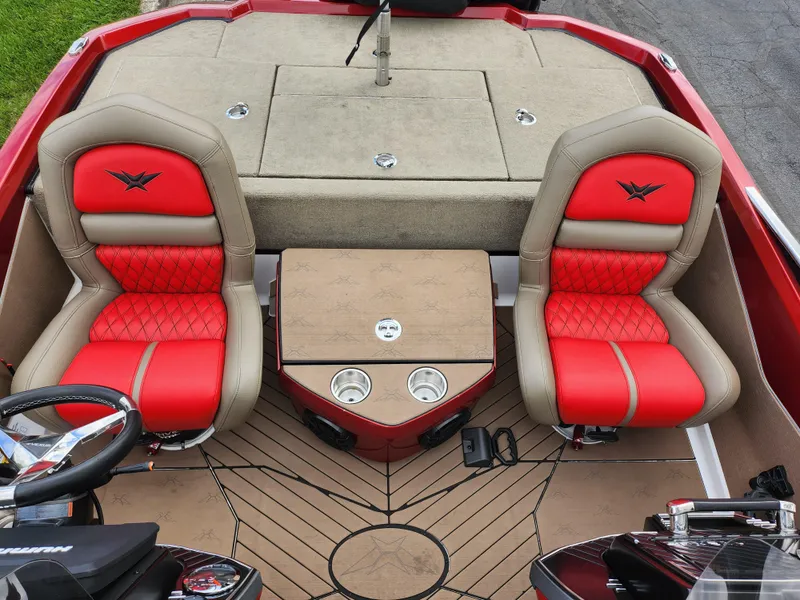 Slide: The Image of 2020 Vexus VX20 boat interior with red and beige seats, center console, and steering wheel. - 22
