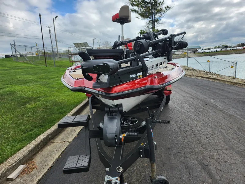 Slide: The Image of 2020 Vexus VX20 boat on trailer, parked near water, featuring Minn Kota trolling motor. - 7